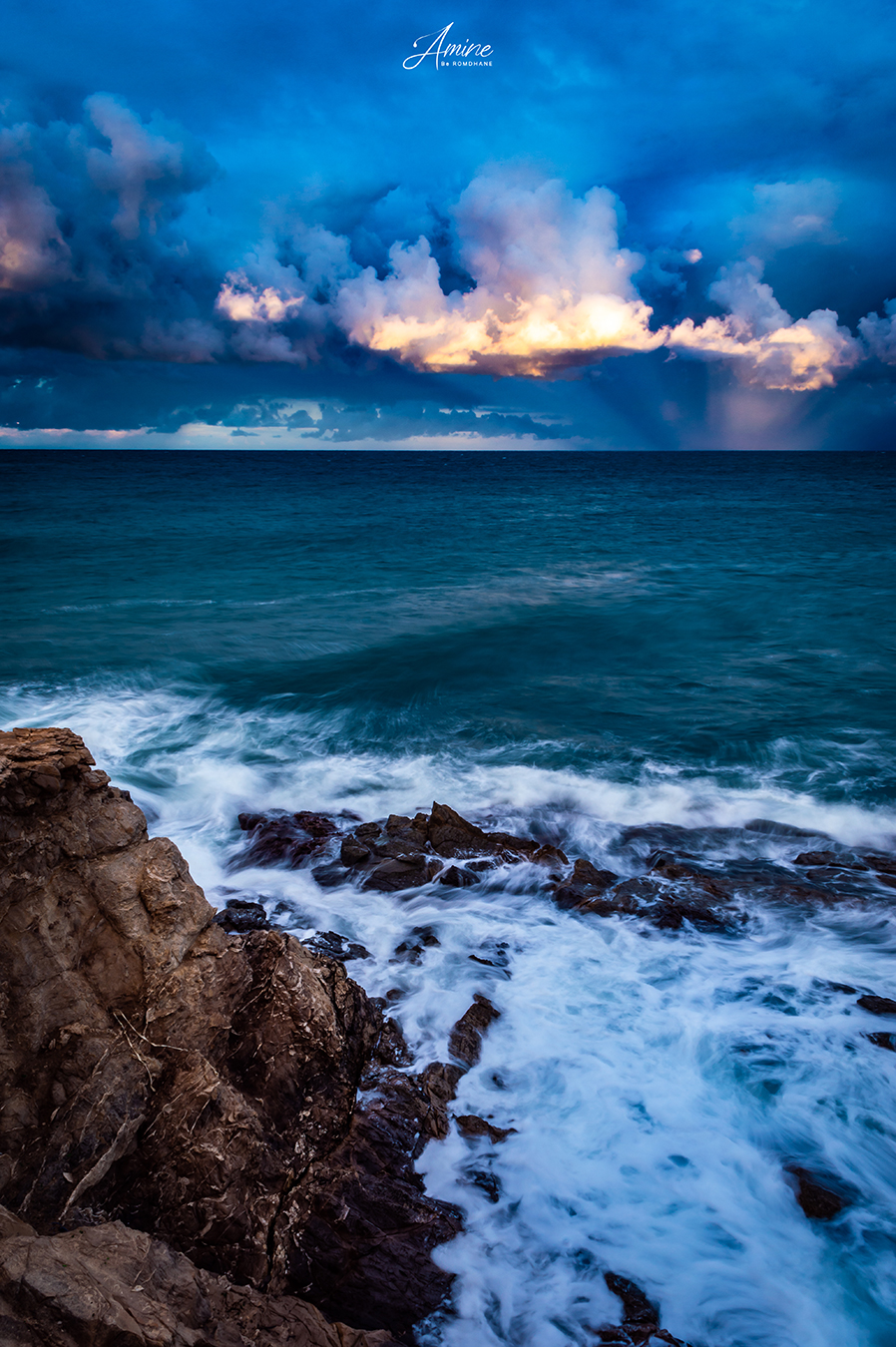 Dramatic sunset over Cap Blanc cliff by Amine Be Romdhane